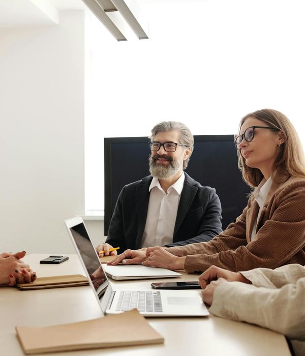 Modern startup workspace with entrepreneurs working on laptops